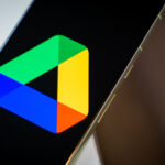 Gogole Drive logo on smartphone laying on desk Stock photo 2