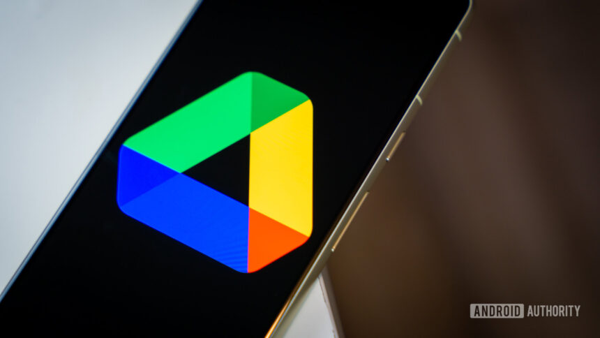 Gogole Drive logo on smartphone laying on desk Stock photo 2
