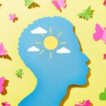 silhouette with sunshine and butterflies paper cutout