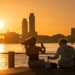 sun rises over new york city in heat wave