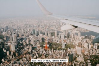 SOCIAL IMAGE PARTNER OFFER TERMS APPLY Tokyo skyline with Tokyo Tower from airplane window Ippei Nao