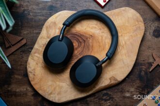 Sony WH 1000XM5 headphones laying flat on wooden table