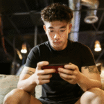 guy playing with a smartphone