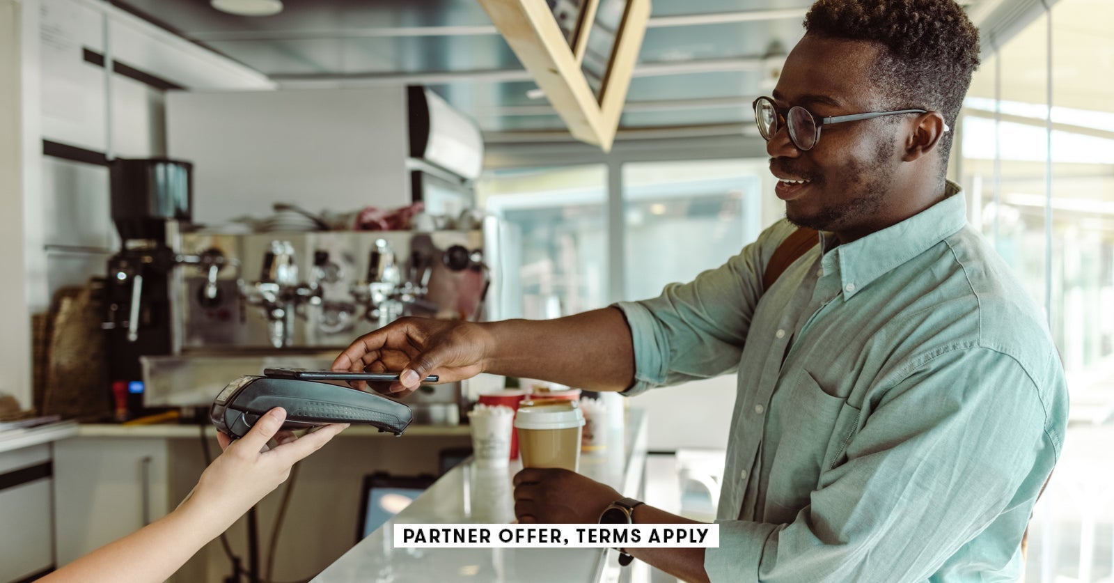 SOCIAL IMAGE PARTNER OFFER TERMS APPLY young man paying for coffee Milko 20