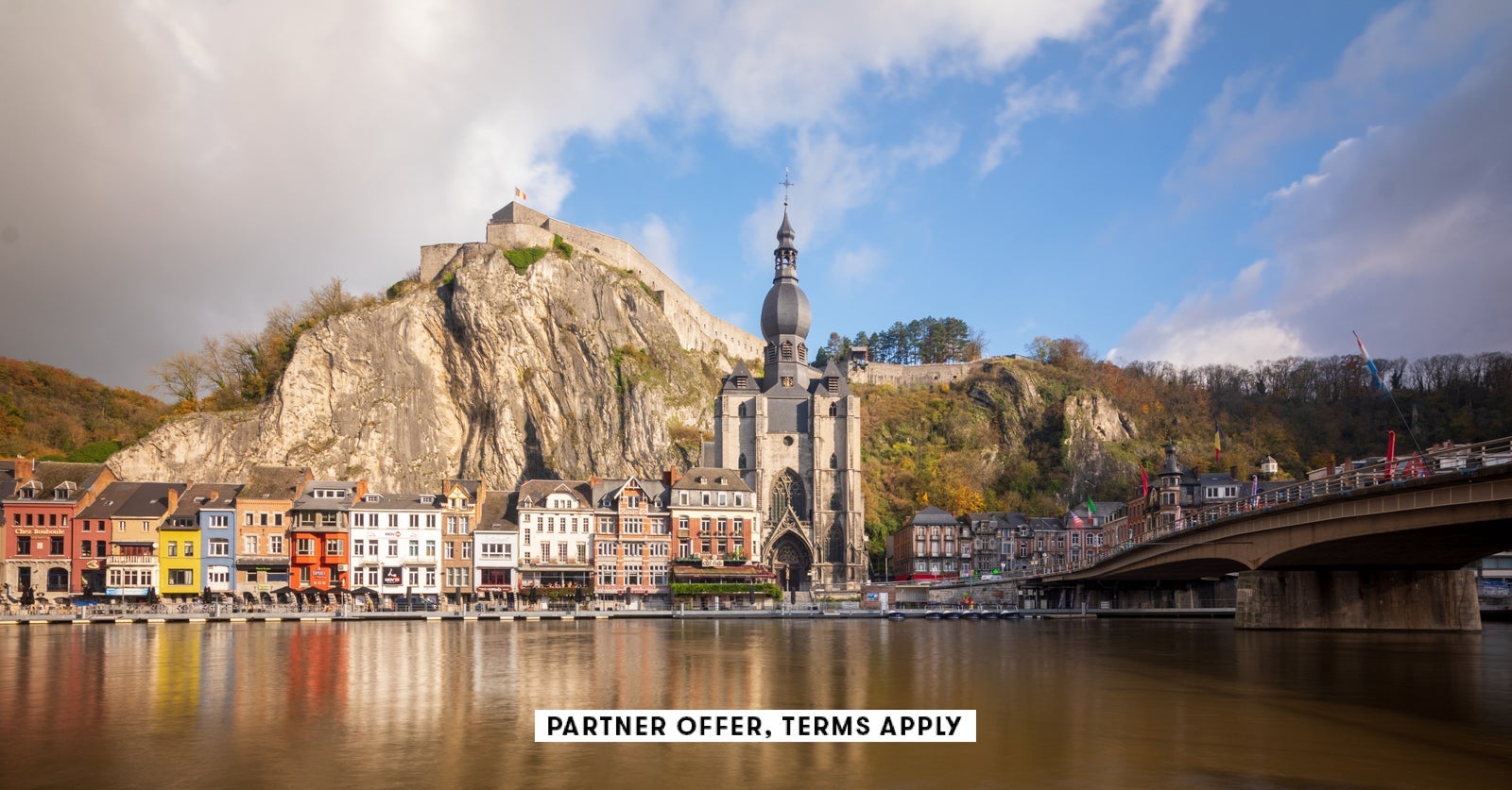 SOCIAL IMAGE PARTNER OFFERS TERMS APPLY Downtown of Dinant in Belgium with famous citadel toped on t