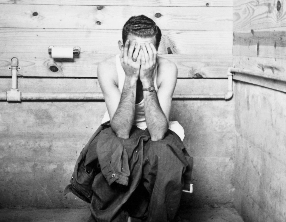 bw man covering face