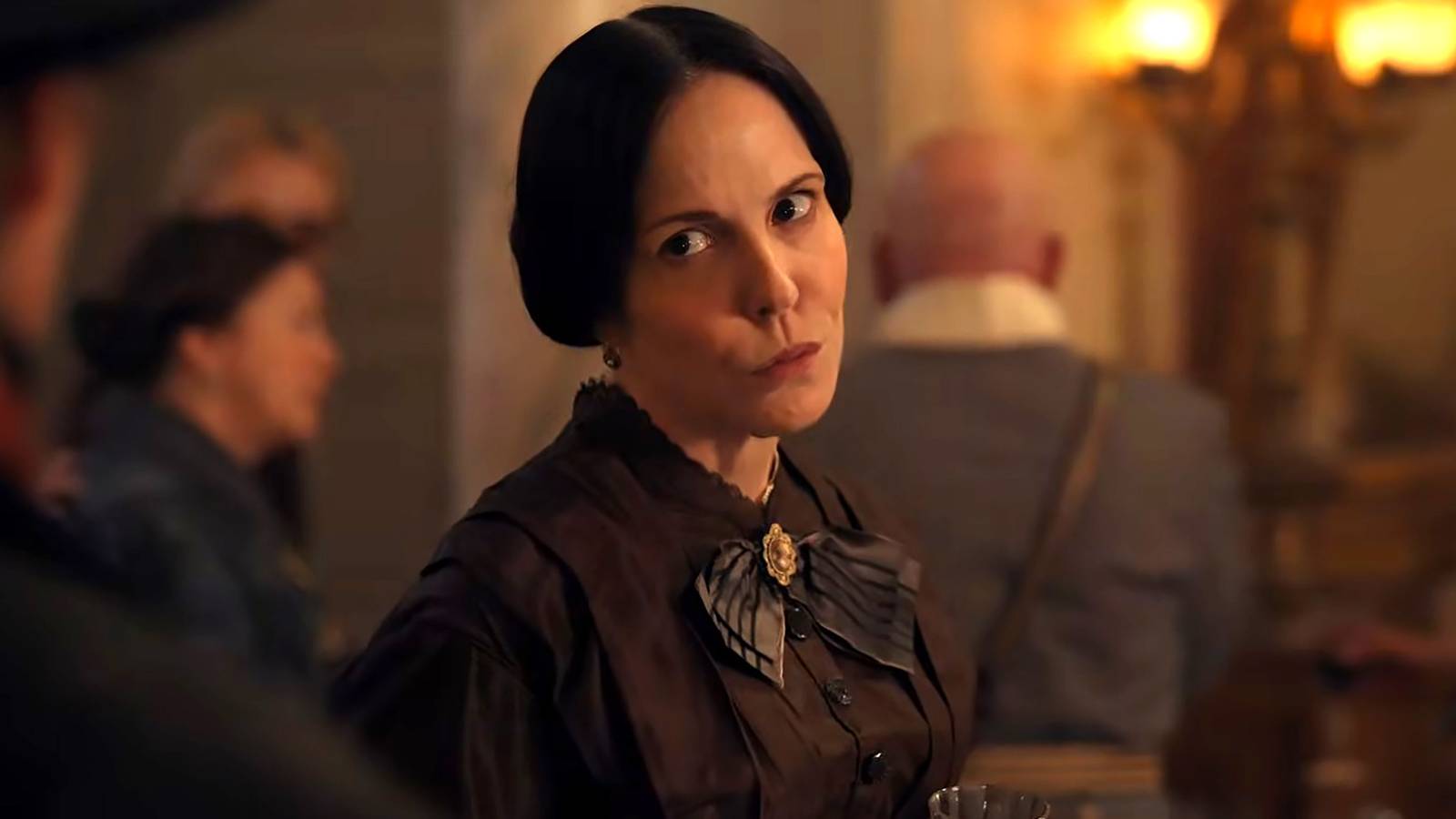 mary louise parker with her lips pursed looking over her shoulder in the gray house