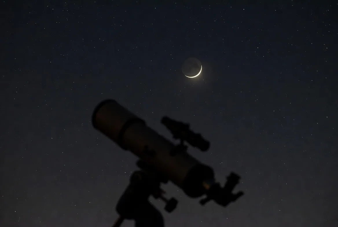 telescope new moon crescent.webp