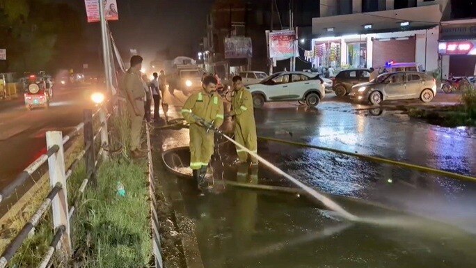 69cb6086aa27d baghpat fire brigade team washing the road photo screengrab 314953322