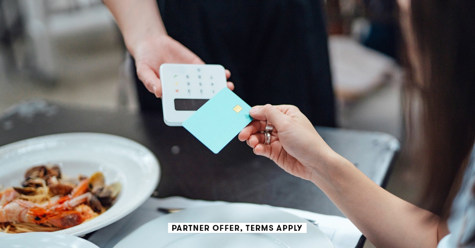 SOCIAL IMAGE PARTNER OFFERS TERMS APPLY Making contactless payment with credit card in restaurant O