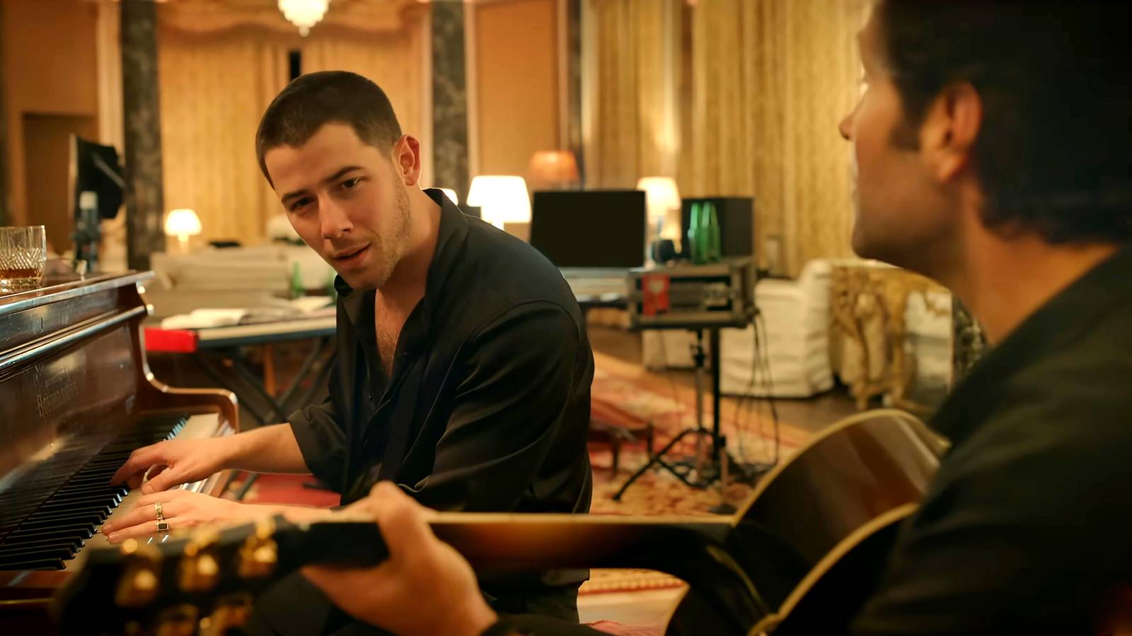 nick jonas danny sitting at a piano with paul rudd s rick next to him holding a guitar in power ball