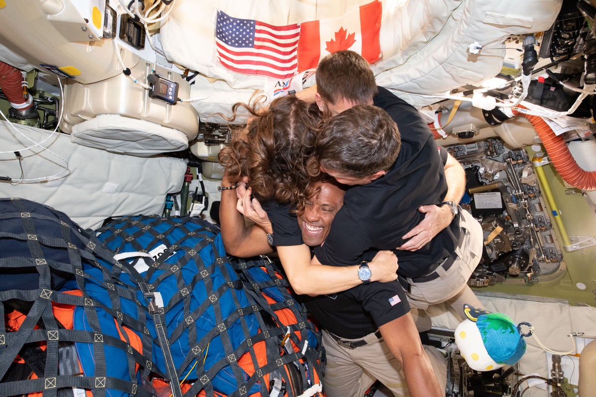 Artemis II crew hug