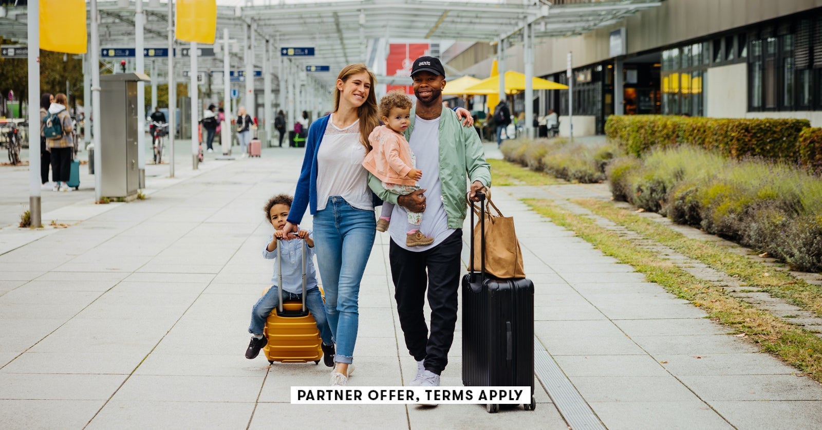 SOCIAL IMAGE PARTNER OFFER TERMS APPLY Family Walks To Departure Gate at airport Hinterhaus Producti