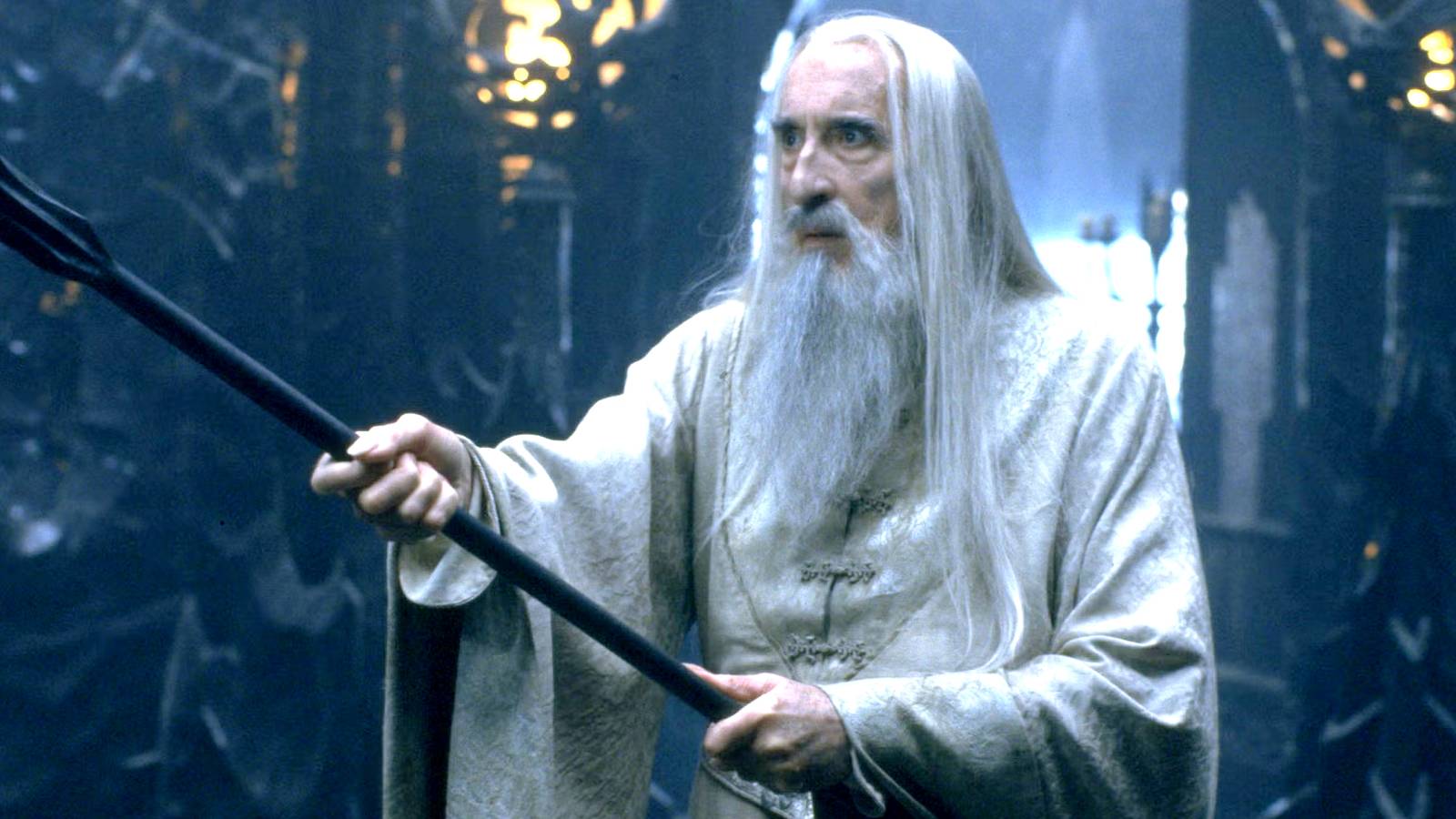 christopher lee as saruman wielding his staff in the lord of the rings