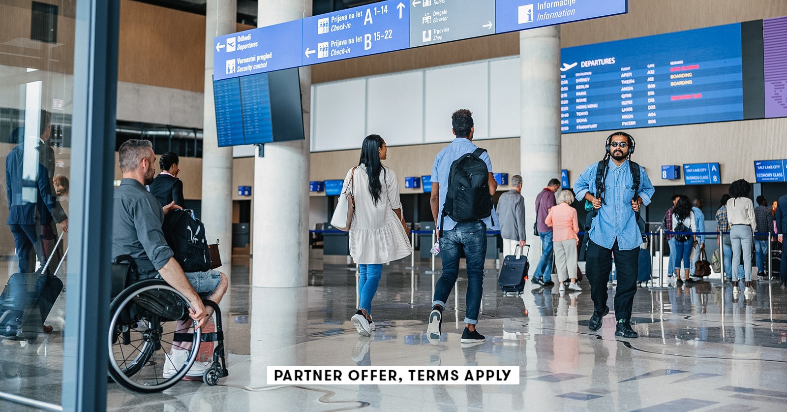 20250715 SOCIAL DISCLAIMER PARTER OFFER TERMS APPLY People walking towards check in counter at airpo
