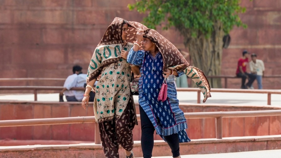 6a0e2d71c30e3 women cover themselves on a hot summer day in new delhi 205348177