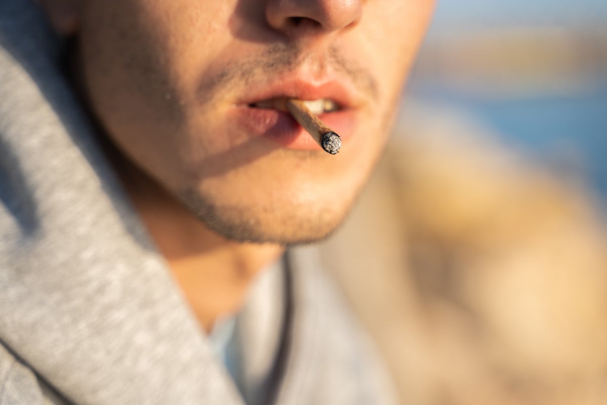Man smoking marijuana joint