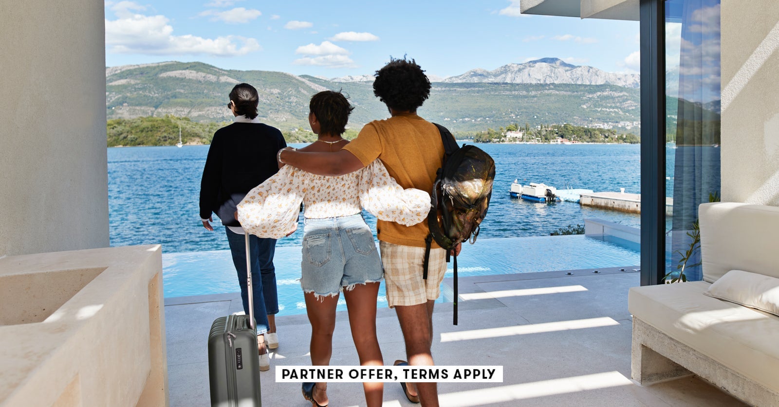 SOCIAL IMAGE PARTNER OFFER TERMS APPLY young couple with arms around walking behind female landlord