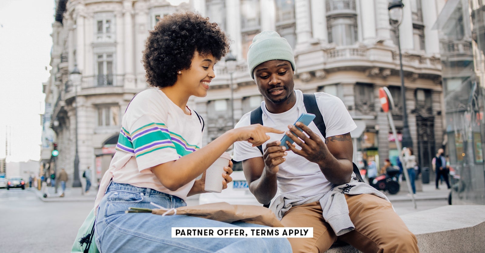 SOCIAL IMAGE PARTNER OFFER TERMS APPLY Friends on vacation using smartphone RgStudio 16