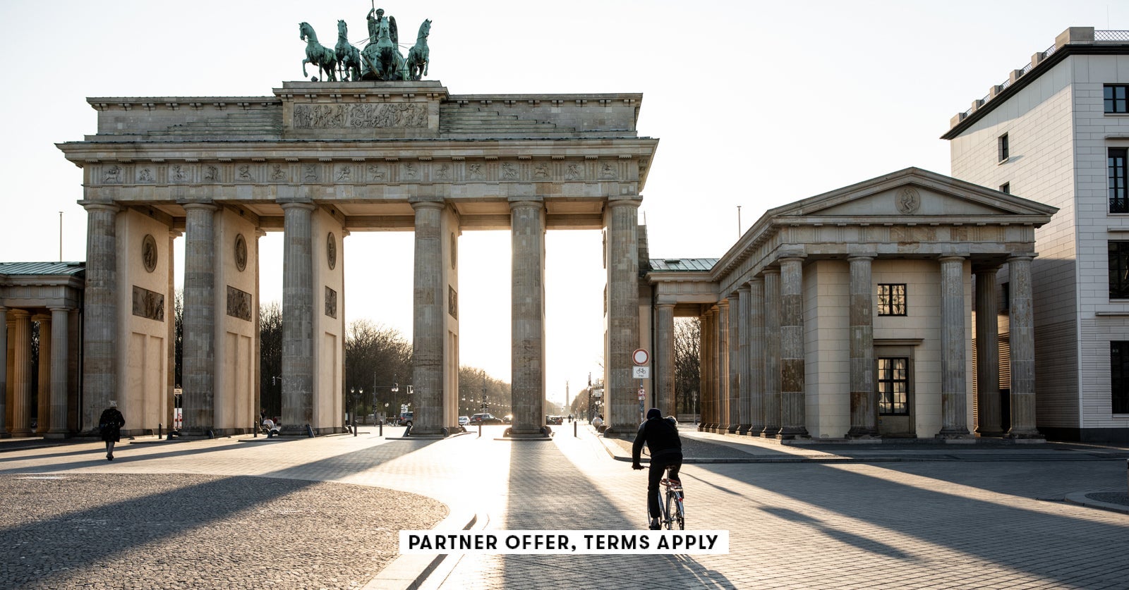 SOCIAL IMAGE PARTNER OFFER TERMS APPLY biker riding past Berlins Brandenburg Gate alvarez 12