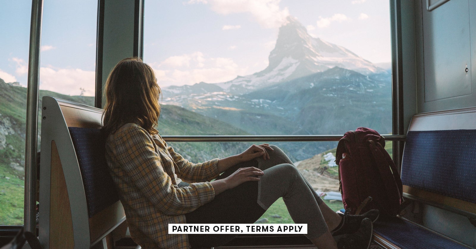 SOCIAL IMAGE PARTNER OFFERS TERMS APPLY woman traveling on the train near Matterhorn Swiss Alps Ole
