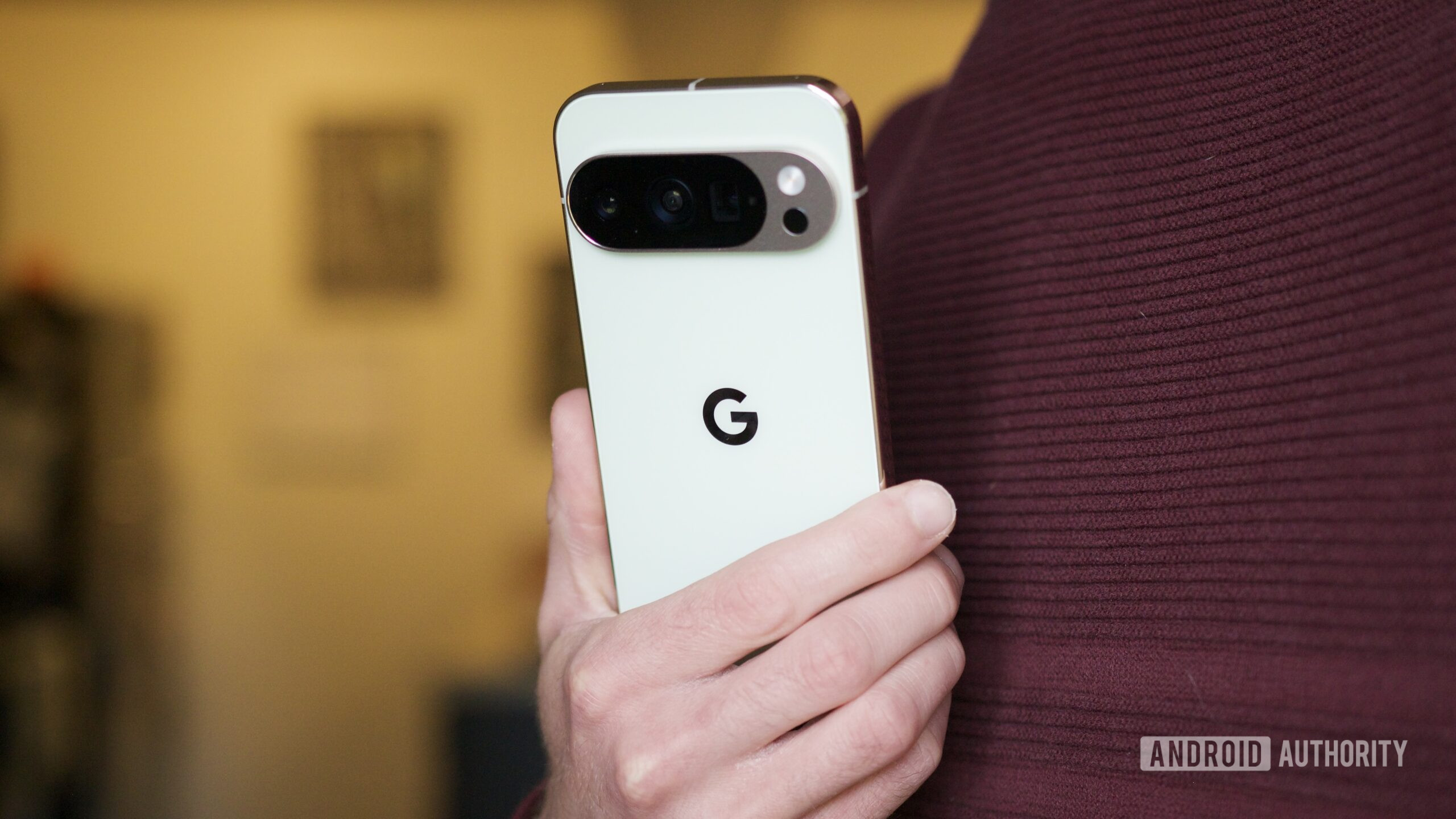 pixel 10 pro holding back of phone hero 2 scaled