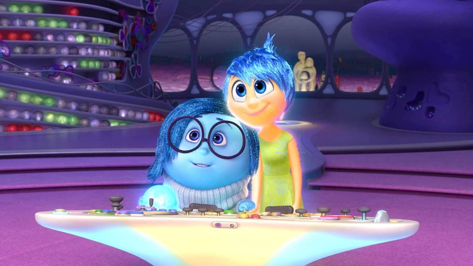 sadness and joy smiling at the console in inside out